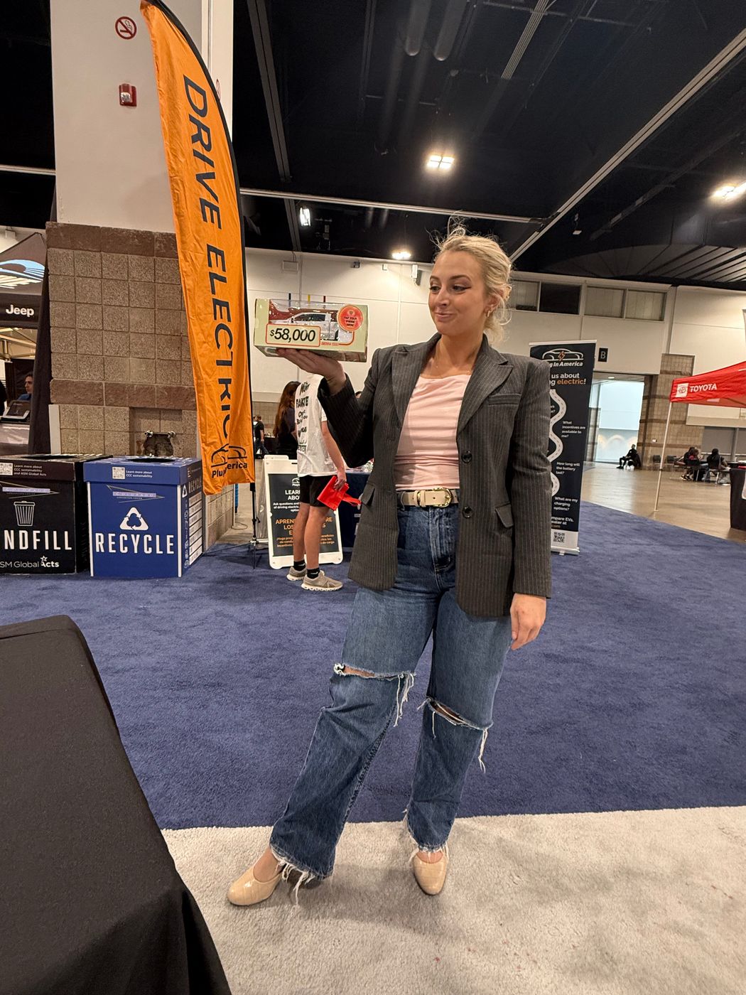 Founder Blue Sitten with the Motibox at the Colorado Auto Show